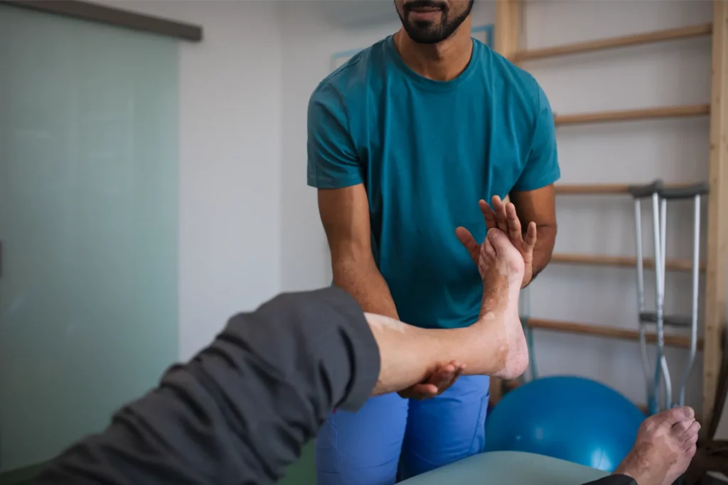 close up of physiotherapist exercising with senior 2023 11 27 04 54 58 utc 1
